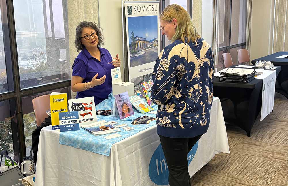 Vendor meeting with an attendee at the TLA District Meeting