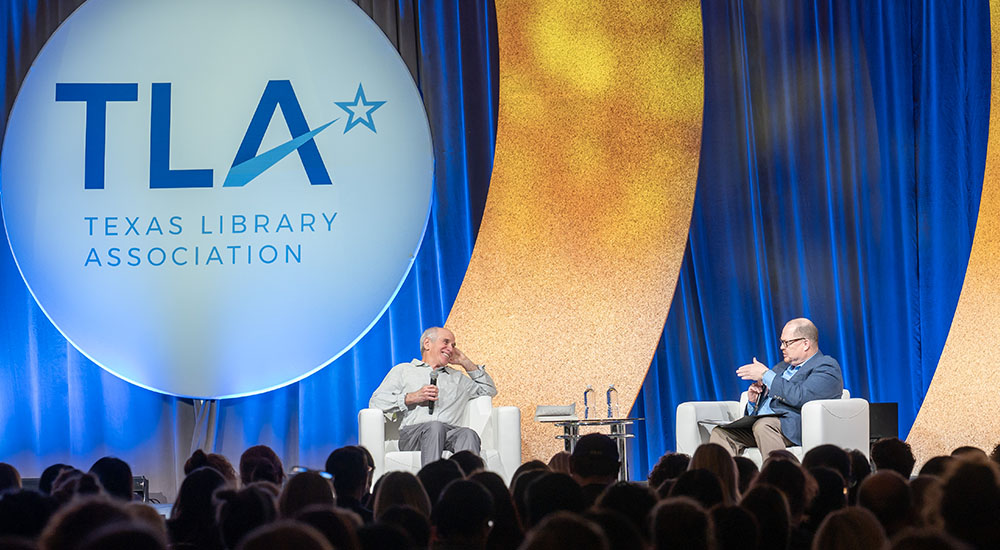 TLA 2025 Annual Conference speaker Louis Sachar onstage with host